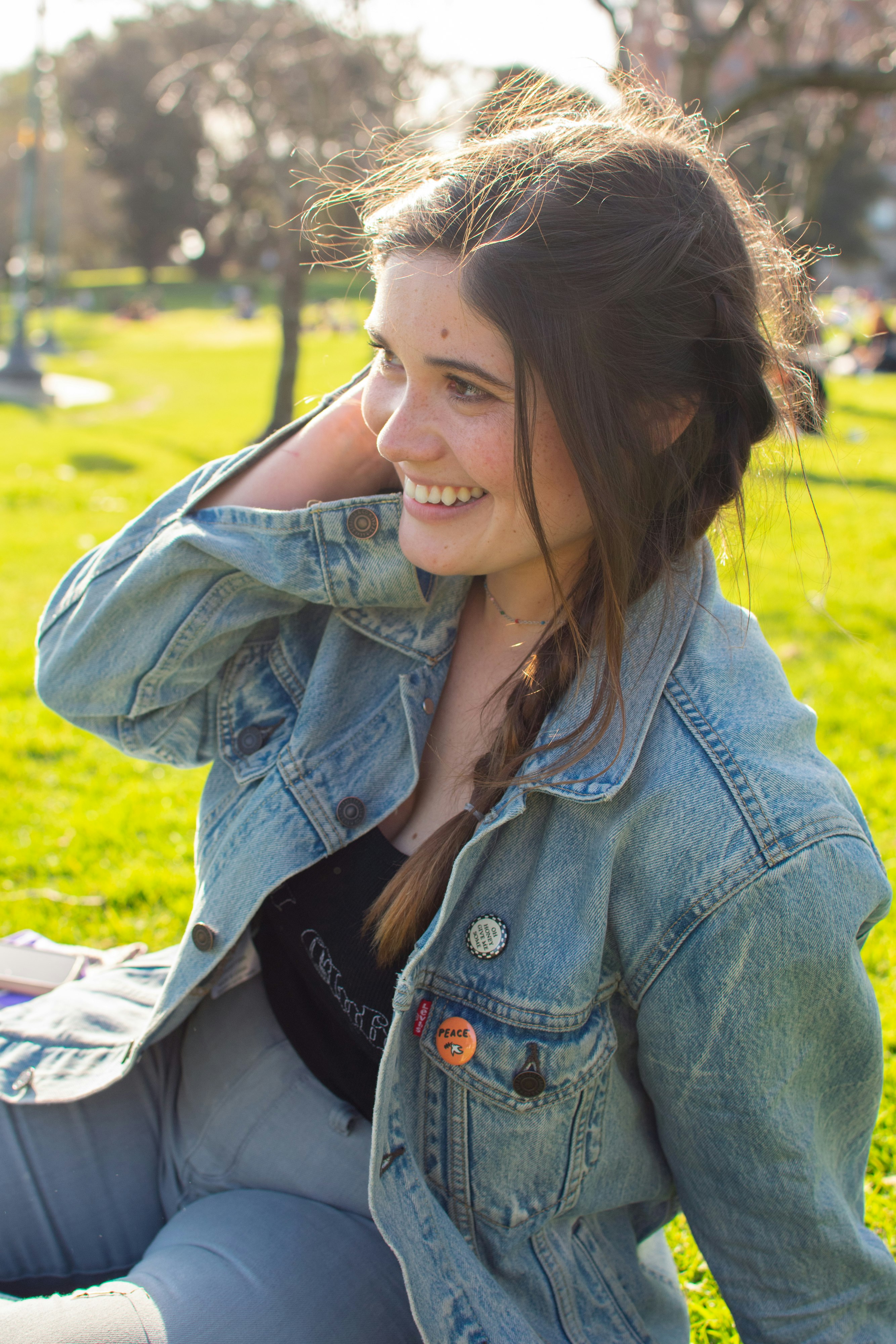 woman in blue denim jacket smiling